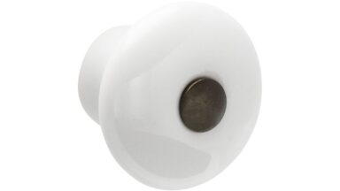 Knopf Nauen Keramik-Druckguss/Metallfuß weiß brüniert - 35 mm lang  vor weißem Hintergrund