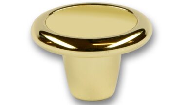 Knopf Stendal Druckguss - Kunststoff glänzend vermessingt metallisiert gold glänzend - 40 mm lang vor weißem Hintergrund
