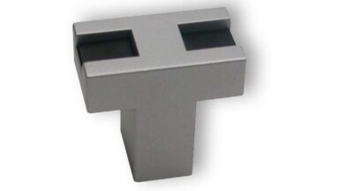 Knopf + Einlage Fellbach Kunststoff metallisiert weißaluminium schwarz - 26 mm lang vor weißem Hintergrund