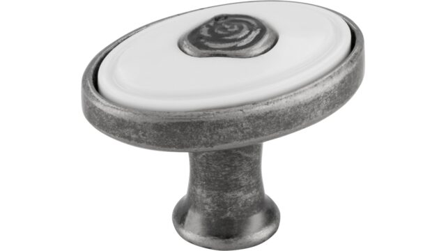 Knopf Brakel Druckguss - Kunststoff altsilberfarbig weiß - 32 mm lang vor weißem Hintergrund