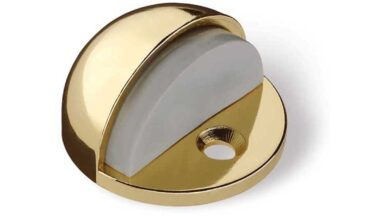 Türstopper Geretsried Druckguss - Kunststoff glänzend vermessingt steingrau - 44 mm lang vor weißem Hintergrund